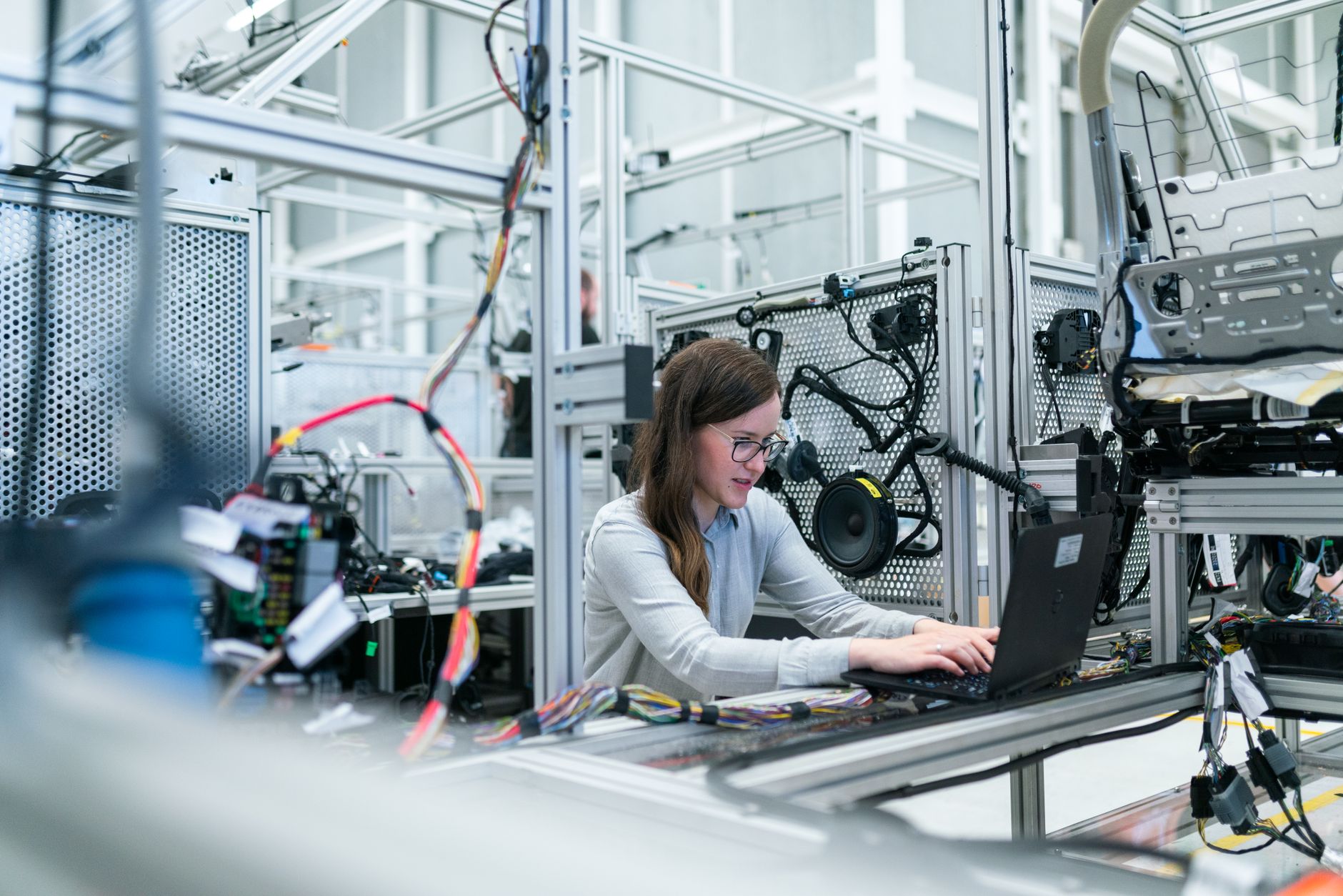 Engineer analysing data beside advanced lab equipment