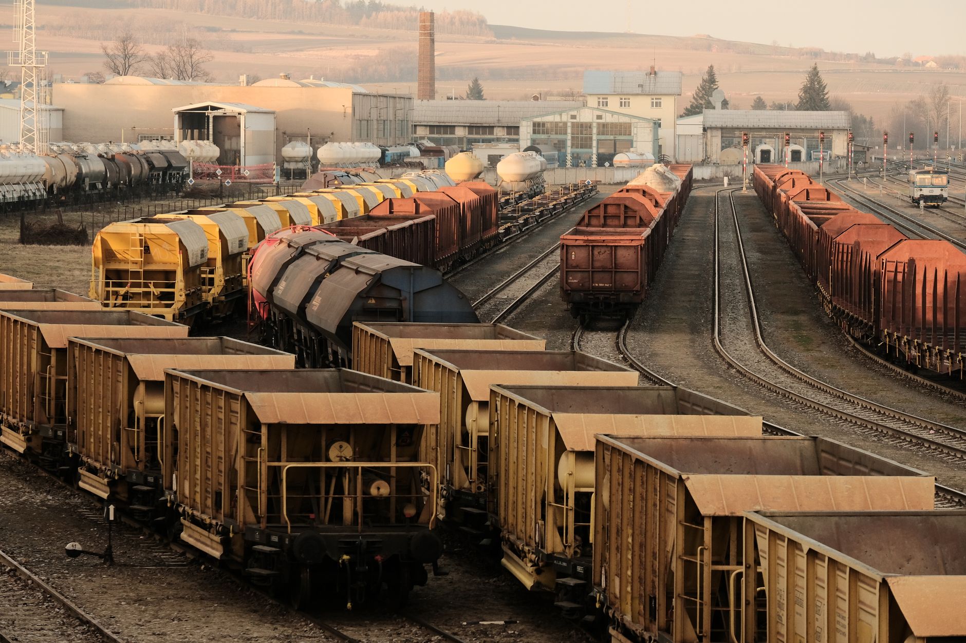 Freight rail yard with multiple tracks and railcars